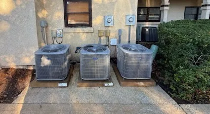 After: Concrete around AC units