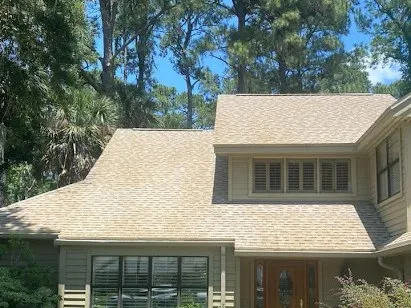 A two-story shingle roof after cleaning